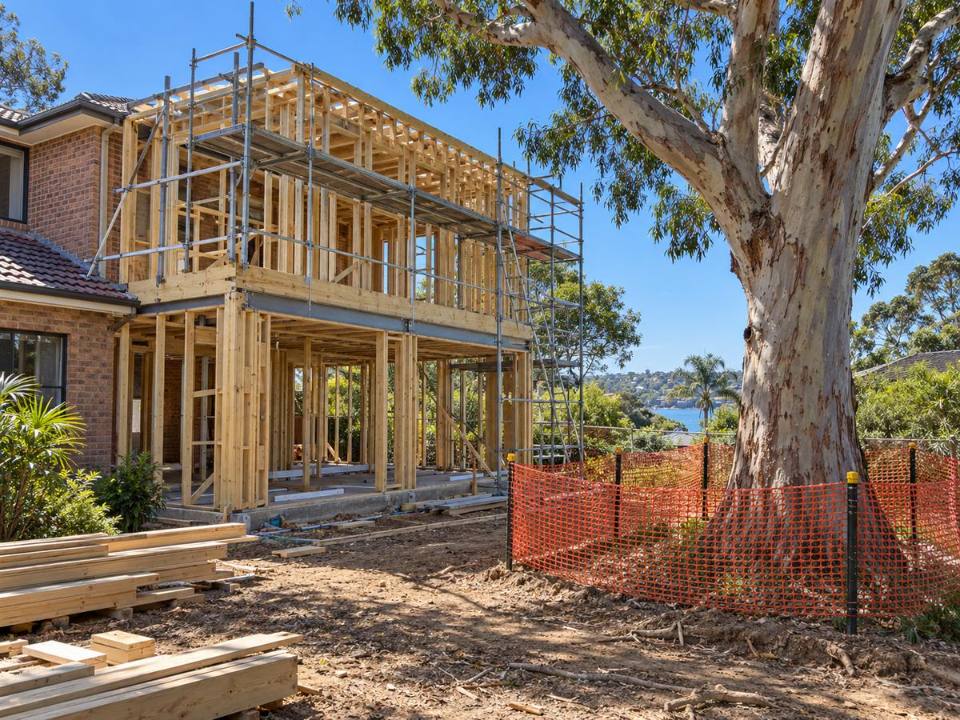Home extension under construction beside a retained native tree